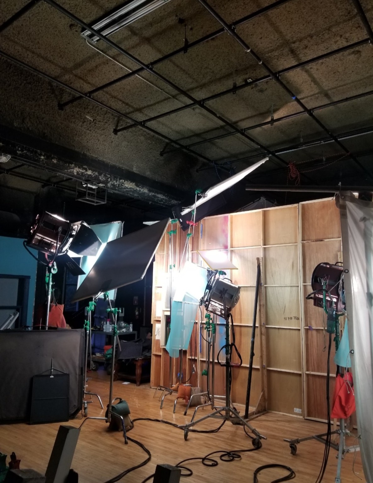Film lighting and grip equipment on a practical set